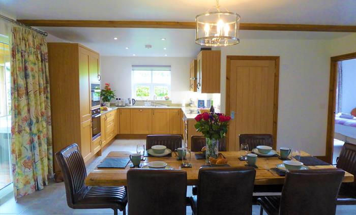 There is a modern dining area and kitchen.  There is access to the veranda from the dining area.  The kitchen has oak cupboards, with built in modern